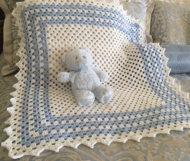 Blue and white crochet baby blanket with teddy bear made from the tutorial