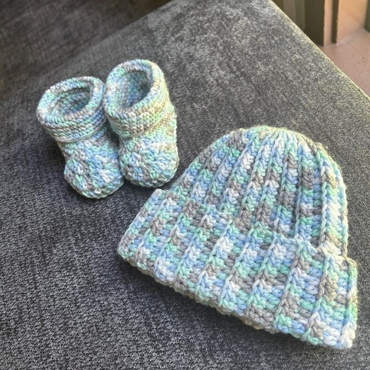 Blue mint and gray crochet baby hat and matching booties made from the tutorial
